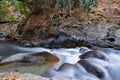 Pure water stream with smooth flow over rocky mountain terrain in the Kakopetria forest in Troodos, Cyprus Royalty Free Stock Photo