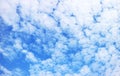 White Altocumulus Clouds Scattered on Vibrant Blue Sky Royalty Free Stock Photo