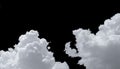 Pure white cumulus clouds on black background. Cloudscape background. White fluffy clouds on dark background. Soft cotton feel of Royalty Free Stock Photo