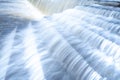 A pure white waterfall background formed in the river through a check dam Royalty Free Stock Photo