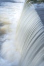 A pure white waterfall background formed in the river through a check dam Royalty Free Stock Photo