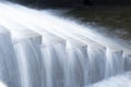 A pure white waterfall background formed in the river through a check dam Royalty Free Stock Photo