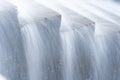 A pure white waterfall background formed in the river through a check dam Royalty Free Stock Photo