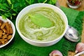 Puree green with spinach and croutons on board Royalty Free Stock Photo