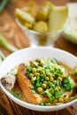 Puree soup with green peas, pickled cucumbers and croutons Royalty Free Stock Photo