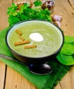 Puree of spinach with croutons on the board Royalty Free Stock Photo