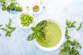 Pureed edamame soup with fresh herbs seasoning  top down view Royalty Free Stock Photo