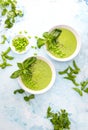 Pureed edamame soup with fresh herbs seasoning  top down view Royalty Free Stock Photo