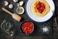 Pureed tomatoes in a ceramic dish and a plate with spaghetti on Royalty Free Stock Photo