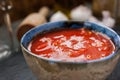 Pureed tomatoes in a ceramic dish on a table Royalty Free Stock Photo