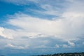 Beautiful clear blue sky with layers of white clouds flying by Royalty Free Stock Photo