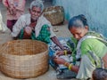 The fisherman family clean the fish on the ground