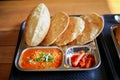 Puri Sabji or Poori Sabzi. Indian snack. Indian fried bread served with spicy vegetable curry and spicy pickles. Delicious looking