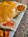 Puri Tarkari or Indian fried bread with vegetables