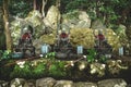 Purification fountain with ladles in the garden of Daishoin shrine, Miyajima, Japan Royalty Free Stock Photo
