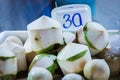 Purified coconuts on the market Royalty Free Stock Photo