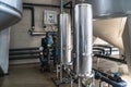 Purified drinking water factory or plant, large iron tanks and water purification filters and automation filtration