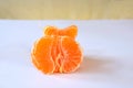 Purified mandarin on the light surface of the table Royalty Free Stock Photo