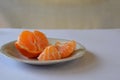 Purified mandarin on the light surface of the table Royalty Free Stock Photo