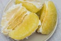 Purified pomelo lying in a plate Royalty Free Stock Photo