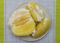 Purified pomelo lying in a plate Royalty Free Stock Photo