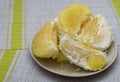 Purified pomelo lying in a plate Royalty Free Stock Photo