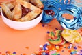Purim background with carnival mask, party costume and hamantaschen cookies. Royalty Free Stock Photo