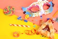 Purim background with carnival mask, party costume and hamantaschen cookies. Royalty Free Stock Photo