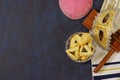 Purim is celebrated with hamantaschen, hamans ears cookies, a carnival mask, noisemakers