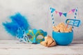 Purim celebration concept with hamantaschen cookies and carnival mask