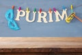 Purim celebration concept & x28;jewish carnival holiday& x29; in front of empty wooden table. product display backdrop.