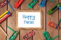 Purim holiday concept with blank photo frame and noisemakers on wooden background. Royalty Free Stock Photo