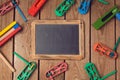 Purim holiday concept with chalkboard and noisemakers on wooden background.