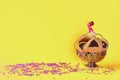 Purim holiday concept with hamantaschen cookies or hamans ears over yellow color background.