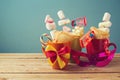 Purim holiday gifts with cookies and candy in cups