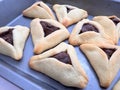 Purim jewish holiday cookies backed Hamentashen Ozen Haman in baking oven tray