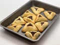 Purim jewish holiday cookies backed Hamentashen Ozen Haman in baking oven tray