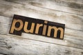 Purim Letterpress Word on Wooden Background