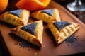 Purim pastries, traditional Jewish dish, national Jewish cuisine, homemade triangular pies with poppy seeds, Hamantashen,