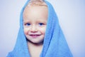 Purity and hygiene education. Child in clean and dry towel. Happy bath time. Image of cute baby boy covered with towel Royalty Free Stock Photo