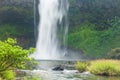 Purity of nature, scenery view of fresh waterfall in the morning. Tad E-Tu Itou waterfall drops over a cliff and tropical plants