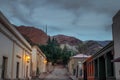 Purmamarca town at night with the Hill of Seven Colors Cerro de los siete colores on background - Purmamarca, Jujuy, Argentina Royalty Free Stock Photo