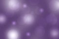 Purple abstract bokeh. Purple and white glowing background with bright blurred circles and glittering stars. Beautiful texture