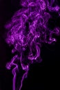 Purple abstract shaped smoke against black background Royalty Free Stock Photo