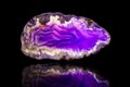 Purple agate slice, black background, healing stone and mineral Royalty Free Stock Photo