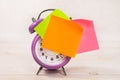 The purple alarm clock has an orange blank sticker. Business planning and development concept Royalty Free Stock Photo