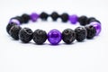 Purple amethyst and lava stone bracelet. volcanic rock. volcanic stone beads. Royalty Free Stock Photo