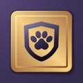 Purple Animal health insurance icon isolated on purple background. Pet protection concept. Dog or cat paw print. Gold Royalty Free Stock Photo