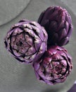 Purple artichokes on a table