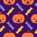 Purple background with cute smiley pumpkins and sweets. Halloween seamless pattern with funny pumpkins and candies Royalty Free Stock Photo